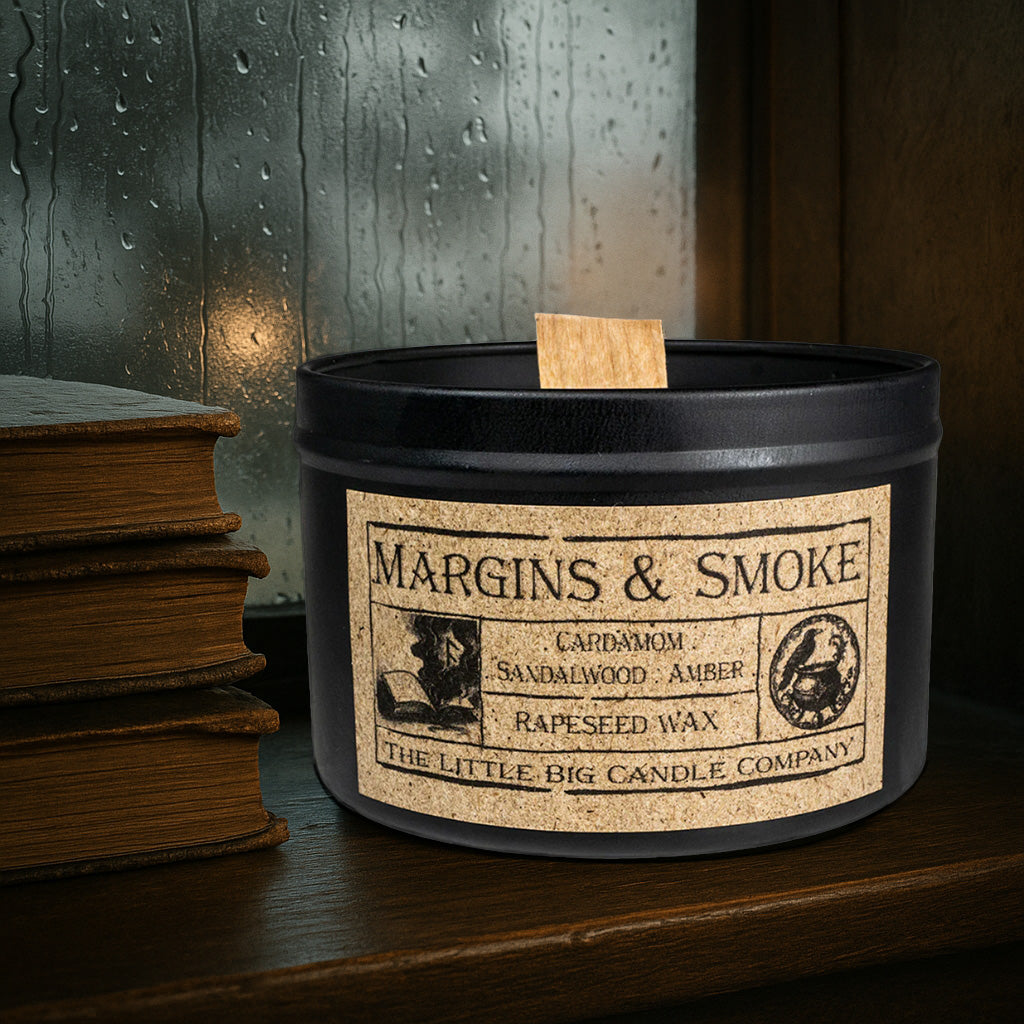 Margins & Smoke candle in black matte tin, rapeseed wax, cardamom and sandalwood fragrance, inspired by literary ritual and quiet libraries.
